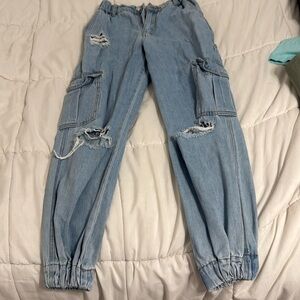 Forever 21 blue jeans with cuffed bottoms.